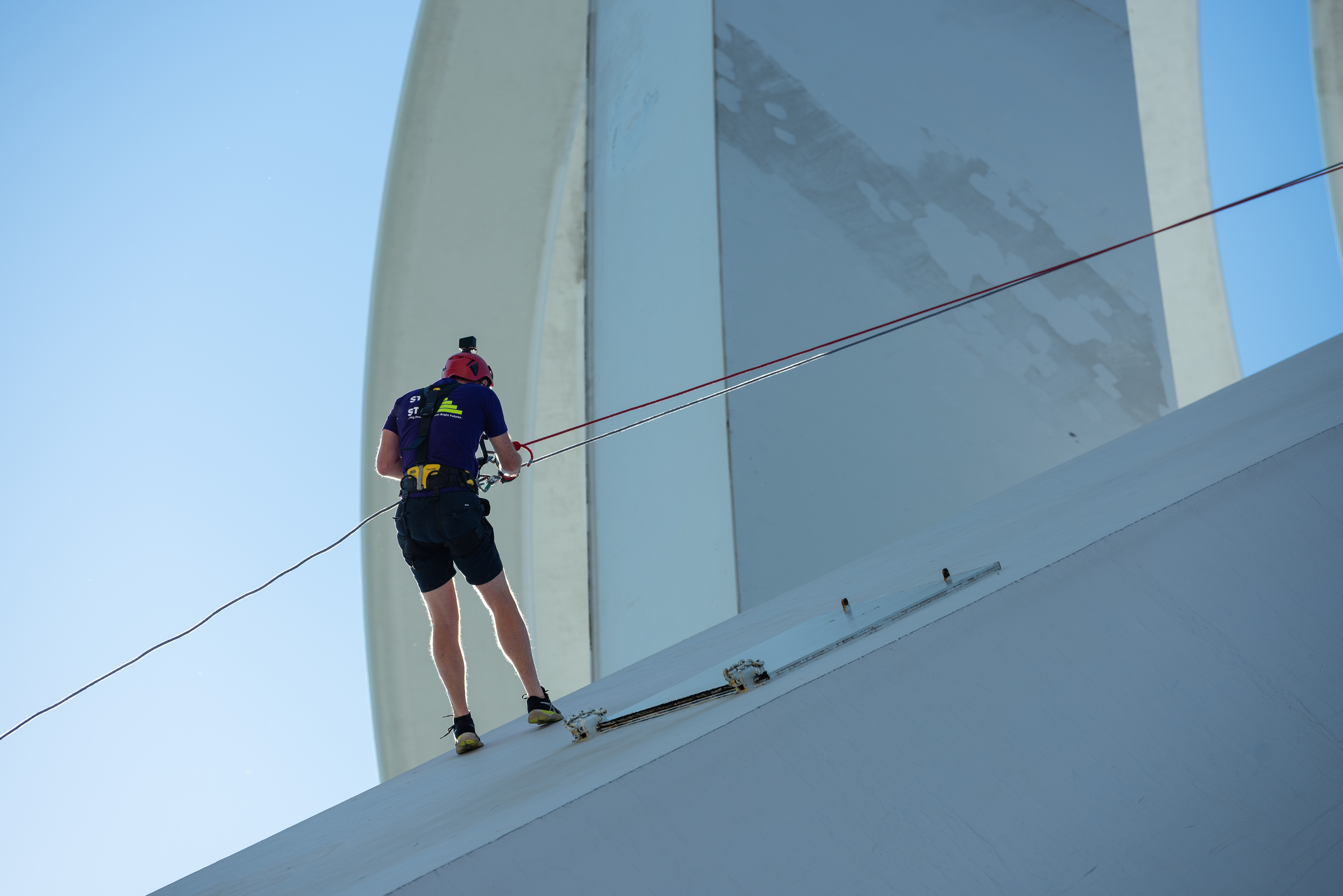 Sideways show of man coming down Spinnaker Tower